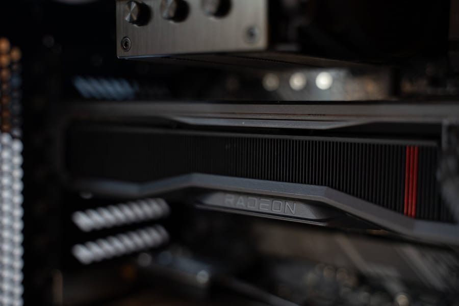 A graphics card seated in a desktop PC, lit from the side.